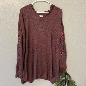 maroon/burgundy top with floral embroidery on sleeves